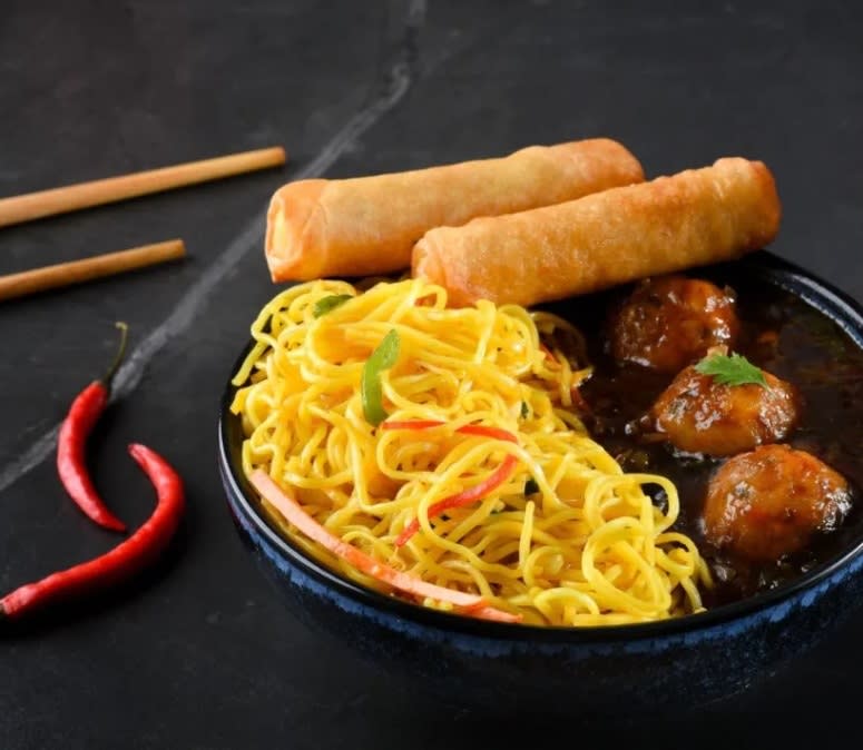 Chinese Cuisine - Noodles Spring Rolls and Manchurian