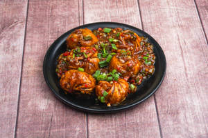 Manchurian momos [8pcs]