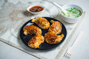 Chicken momo pan fry in schezwan sauce
