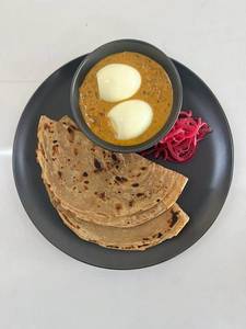 Kadai Egg With Lachha Paratha And Onion Salad