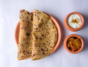 Punjabi Aloo Paratha (2 Peach + curd + Achar