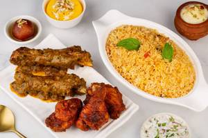 Biryani Rice+2 Piece Mutton Shank Karela+3 Pieces Chicken Kebab