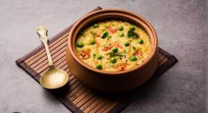 Vegetables Khichdi With Raita And Papad