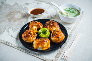 Veg and cheese momo pan fry in bbq sauce