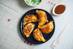 Chicken and cheese momo pan fry in bbq sauce