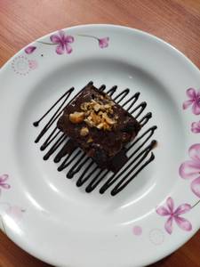 Signature Chocolate Brownie With Chocolate Sauce & Nuts