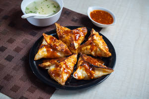 Corn and cheese momo pan fry in hot garlic sauce