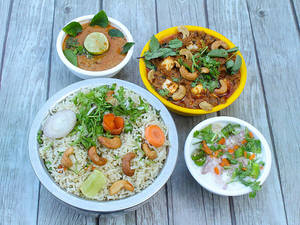 Spl Veg Fried Rice With Tomato Cashew Curry
