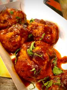 Chicken Darjeeling Pan Fried Momo in Schezwan Gravy