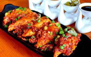 Exotic Veg Pan Fried Momo in Schezwan Gravy