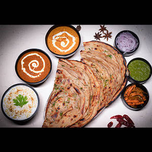 2 Laccha Parantha + Dal Makhani + Shahi Paneer + Raita + Salad