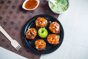 Veg and cheese momo pan fry in hot garlic sauce