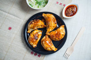 Chicken and cheese momo pan fry in schezwan sauce