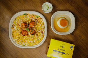 Chicken Tikka Biryani (regular) Free + Free Caramel Custard