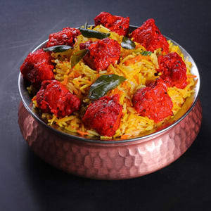 Andhra Chicken 65 Dum Biryani Served With Salan, Raita And Salad (10-12pc Chicken)
