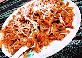Schezwan hot pasta with cheese