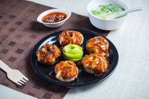 Pork momo pan fry in schezwan sauce