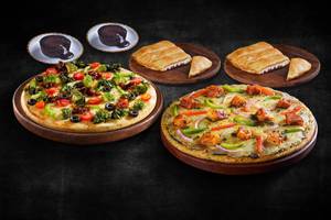 2 Veg Medium Pizza + Free Garlic Bread & Choco Lava (Save Rs 510)