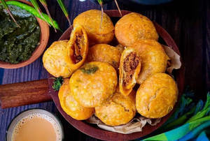 2 Plate Kachori(4 Pcs) With three Sabzi (aloo+cholay+sitafal and salad)+ 2 Malpua