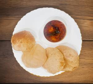 8 Poori with Aloo Rassa Sabzi