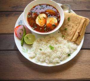 Egg thali- egg masala 2 egg + dal fry+ jeera rice+ 3 tawa roti+ papad + achar + salad + 
