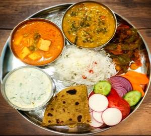 Deluxe thali- 1 mix veg+ 1 paneer masala+ 1 dal fry+1 jeera rice+3 tawa roti+ papad+salad+achar+