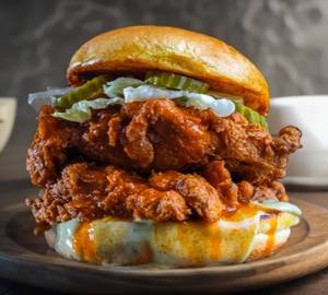 Malai boti burger with tahini pickle and cheese