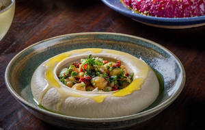 HUMMUS (Served with our house-made puffed pita)