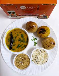 Dal baati mini meal served with jeera rice and churma