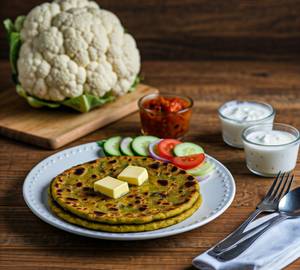 Aloo Gobi Paratha (02 Pieces) - Served With Chutney, Sauce, Curd & Salad.