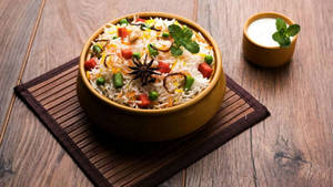 Veg Biryani + Curd (100% Restaurant Menu Price)