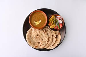 Dal Makhani + 4 Butter Roti + Salad + Raita      