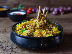 Dum Mutton Biryani Served With Raita & Salad