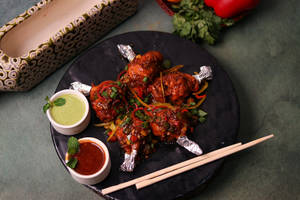 Chicken Lolipop In Hot Garlic Sauce