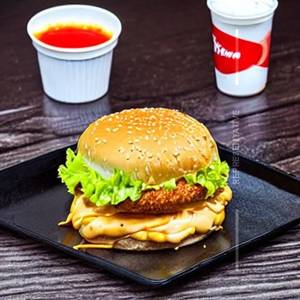 Chicken supreme cheese burger, French fries, lime juice, garlic dip, tomato sauce