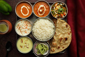 Special Thali (dal Makhni + Shahi Paneer + Seasonal Veg + Rice + Rayta + Salad + Achar + Roti + Sweet Dish)