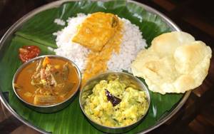 Pothichore With Fish Curry