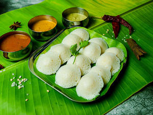 Button Idli Dipped In Sambar With Ghee