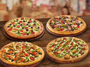 Free [ 7up 250ml ] + 4 Veg  Single Topping Pizza