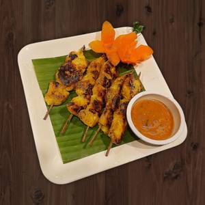 Satay gai grilled chicken skewers served with peaut sauce