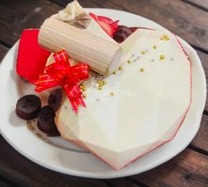 Eggless   Vanilla Pinata Heart Shape Cake