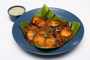 Tossed ghee garlic masala button idli