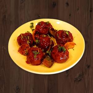Veg Pan Fried Momo in Schezwan Gravy