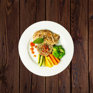 Herb Roasted Chicken Served With Tossed Vegetables