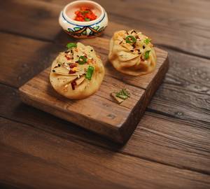 Sesame tossed mutton momo