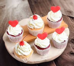 Valentines special vanilla cupcakes with cherry on top
