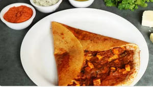 Paneer Schezwan Dosa (Served with Cocunut Chutney, Red Chutney and sambar)