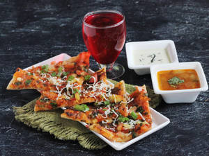 Tom Chi Uttapam (Served with Cocunut Chutney, Red Chutney and sambar)