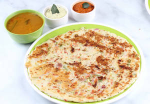 Plain Uttapam (1 Pcs) (Served with Cocunut Chutney, Red Chutney and sambar)