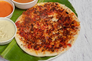 Tomato Onion Uttapam (Served With White Chutney, Laal Chutney And Sambhar)